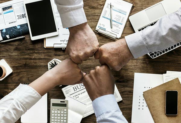 business team meeting hands together